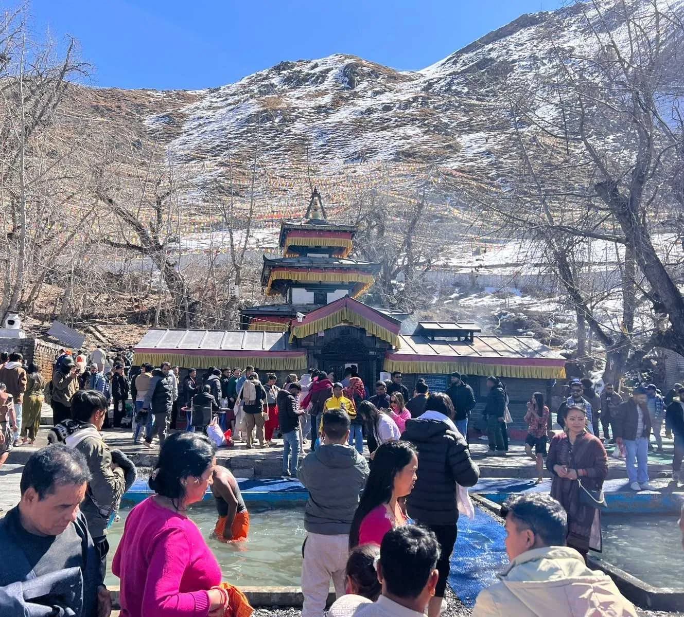 Pilgrims at the Muktinath Temple and sacred bathing pools during a tour in Mustang
